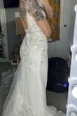 This was initially my number one choice! Very flattering, even better than pictured. Only thing that didn't work for me was the bust. It was a little low cut; I don't fill it out completely because of my bust size. When I bent down, the top was very revealing - Darina L.