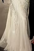 I tried on about 9 Lulus wedding gowns, this was the last one and it was it! Fit like a glove but not too tight. It was not too heavy or too long. I didn't have to make any adjustments and was able to wear a bra with straps without issue. Thank you Lulus for a beautiful affordable and great quality garment! My favorite part was the beading design (sort of reminded me of the 20s!) and the bottom of the dress with the subtle tulle! - Stephanie H.