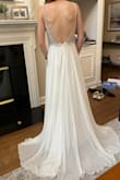 This dress is stunning! I received so many compliments and was so comfortable in this dress on my wedding day. I love the beading on the bodice and it was not see-through. The skirt needed a little hem but the bodice fits perfectly for my size 2 top (I am an A but I think a few other cup sizes could work with this bodice). There is not a lot of stretch in the bodice so if you are between sizes, consider sizing up. It was a cooler/overcast summer day and I did not get hot (but also typically run cold). I've already offered this dress to other engaged friends to borrow and I am planning on getting it hemmed to knee length for anniversary celebrations. Highly recommend!! - Patricia R.