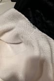 I'm returning this. I wore it once and the back ripped. Poorly made and a bit hot. I ordered the black one too so I'm hoping that one doesn't unravel too! - Holly S.
