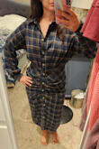 The dress fits perfectly in the hips and waist but is a little bit bigger on top, but not so much that I would want a different size. The material is soft and great quality. The button holes are very tight, which I was annoyed with at first, but then realized it's better that they're tight to avoid any slipping open. - Kristin M.