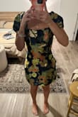 I ordered this dress for my sister's rehearsal dinner and I love it. It fits perfect and is really different in its pattern and shine. The sleeves look better on the shoulder in my opinion. Having them hang off gives me some 80s prom vibes. - Emily O.