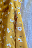 I wore this for my engagement photos and they turned out stunning. I typically am a size M but the Large was just right around my waist but tight on my chest since there is no give in the material. I am disappointed because having only worn it once, the outer material is so thin the seam on the side of the waist pulled apart. The seams seemed questionable and were already starting to look like they were going to fray when I put the dress on, but I thought it would hold up. The whole side ripped and the front has little threads popping out all over the front seams. I am really disappointed that I paid almost $100 for a dress I only got to wear once. I am not sure a seamstress can fix the way it pulled apart. Thankful I got my photos, but sad I don't get to wear it again. - Courtney G.