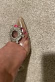 I got these because they were recommended with the dress I ordered. These shoes are BEAUTIFUL! And they fit perfectly to your size (def use your half size if you are one). The heels look thin but then the wide base of the actual heel made it so much easier to walk in& and I was hesitant because I hadn't worn tall heels in a couple of years. I have wide feet and the shoe is tight at first but will form/stretch to your foot as you wear it. It gives off Cinderella vibes. Definitely add them to your wardrobe. - Marciana L.