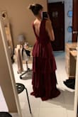 I have a similar fit to the model in the dress (minus the height) so I guided myself to order the same size she is using, and it fit perfect. The dress is long, but with super high heels, works perfect for me. Nice material, nice color, and it arrived sooo fast. - Frances L.