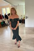 The fabric this dress is made of is wonderful! It doesn't wrinkle, holds its shape, and is the he perfect length and cut! It looks like its photos too. I received countless compliments on this dress! I highly recommend this company! - Lynn G.