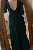 This dress was out of stock for a few months, when it was restocked I ordered it right away. Based on the reviews, I ordered a size smaller (M) but I wasn't able to zip it all the way up, so I exchanged it for a large and it fits perfectly! Will definitely need to wear heels based on the length. - Emily H.