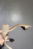 They are lopsided. It appears the shoe was made for a taller heel, so the shape without pressure has the toe pointed up a lot. They do not lay flat on the floor and wobble. Very weird to walk in. Also, they run small so my toe overhangs the show. I have bought many shoes from this brand so I am definitely a 7 and I ordered a 7. Also, the insole is not flush and tight to the shoe as it usually is in these shoes. - Alexzandria K.