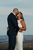 I am not kidding when I say that I made a day-of decision to wear this dress on my wedding day instead of wearing my actual wedding dress. The beading and detail are absolutely gorgeous. I received non-stop compliments from everyone and still do a year later. Everyone thought it was from an actual wedding dress shop and were shocked when I told them it was from Lulus and how inexpensive it was. Outside of being beautiful, it fit like a GLOVE and was extremely comfortable. I had a TON of issues with my actual wedding dress/seamstress and it never fit correctly but I didn't have to make any alterations to this dress. Originally this was going to be my second outfit, but I made the right choice by deciding to wear it the entire time. I would recommend sizing up if you're in between sizes. I decided to size up knowing that there wouldn't be much stretch with all the beading and it worked perfectly. - Laura S.