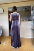 The color is as the photos show but maybe a little more lavender? The fit is consistent with other dresses. I'm a true Lulus XS. I was wearing heels and the length was about a half inch too long but that's not a major con. Wearing this as a bridesmaid's dress where the bride chose velvet as the unifier and it's bride approved! - Katey F.