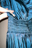 This dress is a flattering fit for my large bust and apple shaped body. It offers a lot of stretch and comfort, while still offering an elevated look. The color is not as it is in the pictures online, which was disappointing. What made me the most sad was it shipped with a hole in the fabric on the waistline that I will have to pay additional for, to fix. I wish the fulfillment staff would have paid a little more attention to those details. - Morgan W.