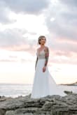 I was lucky enough to wear this dress twice! I had to get some alterations, mostly on the bottom because it was so long, but kept the train super long which was beautiful!
Highly recommend this dress! It looked beautiful on the beach in Mexico! - Amy R.
