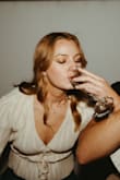 I wore this top for engagement photos and it was perfect! I had to pin it a little because it's very low cut but otherwise, perfect top for the occasion! - LIndsey M.
