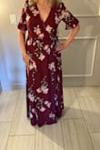 I purchased this dress for an evening wedding and it was perfect. I debated whether to get a small or a medium as I am a size 6 and a small fit great. I was glad there was a snap already at the bust because I would've needed to pin it. It takes a minute to figure out the wrap part of the dress but once you have it wrapped, it's very secure. Tall girls will definitely like this dress. I am 5'5 and I had 2 1/2 inch heels, and it was just barely touching the ground.
The color was beautiful for an early fall wedding, and I got a lot of compliments. You can dress it up with jewelry and heels, or add a leather belt and short boots and dress it down. - Jessica K.