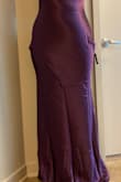 This dress was so disappointing and the product I received was defective. First, the strap is just an elastic band with no adjustments. It can fit weirdly on top and there's nothing you can do to fix it. Second, the dress I received had extra fabric on both sides. At first, I thought it was just tight but no matter how much I smoothed it out, the the extra material was still there. And the inner lining fit perfectly with no clumping. Very upset because I was going to wear this for my first wedding anniversary. Save your money and get something else. - Amreen S.