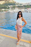I bought this beautiful satin wrap midi skirt and it was perfect for walking around Capri Italy in the hot sun. It kept me nice and cool. I also wore it to a friend's baby shower later that month. I'm sure I will get many uses out of this well made satin piece. - Annette G.