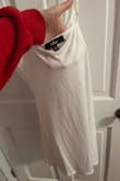 Bought this for my reception. It is cute, but it was not good quality. Only 10 minutes of wearing, the fuzz on one of the sleeves broke and was hanging down. The slip under the dress is super small and see through. - Rachel S.