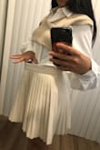 This is the exact skirt I've been looking for! The material is excellent, and the length is perfect. It can be worn in a professional setting with the right outfit. I followed the size chart and ordered a Medium, but it was too large, so I'll exchange it for a Small. - Ester F.