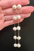 These earrings are beautiful! I wore these for my bridal shower and they went perfectly with my dress and heels. I must say one of the top pearls did have a round carving on the front and the backs of each pearl are flattened a bit so they do not look completely round from a side angle. They are imperfect pearls but that made them perfect! - Rebecca S.