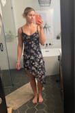 This is a beautiful dress, but the fit is strange. I ordered in a small and medium because I typically wear a small but the Lulus fit finder suggested medium. The top on both was snug while wearing a bra. If I had taken the bra off it would have been fine but it's unusual for my small 34B push-up bra to cause a dress to be tight on top. The rib cage up through the bust was tight. The actual waist area was loose. I have a small waist and am used to this but not combined with the rib cage area being tight. The long side is a nice length and I love the idea of the high-low length change. As another review mentioned, the short side is SHORT. I am 5'6". A couple of inches above fingertip length, which is fine for jean shorts but not for a semi-formal dress IMO. The underliner hits just past the crease of my butt cheek, where my hand is in the rear-facing picture. The medium hit at about the same length. The way the cut and material fall really takes away from the beautiful floral pattern & material. Returning. - Annika S.