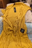 The material is pathetic. It's totally crushed and this picture and information are misleading. In reality, this is like a maternity wrap-up gown with loads of wrinkles. This is so much worse than local department stores. - Parul D.