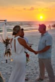 This dress was perfect for a beach ceremony. I didn't want to deal with an elaborate dress with a train while trying to walk on the beach. It was simple and elegant. I wore it with shapewear boy shorts and backless stick-on cups for bra support. I'm tall, 5'10", and the length was perfect. - Brooke B.