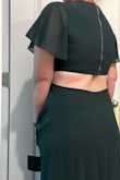 I loved this dress a lot but didn't find it that flattering on me so I did end up returning it.  The top was slightly tight on me, but not too bad.  I could've lived with it.  The color is so so dreamy.  The length was perfect. - Avery K.