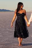 The tulle layer with the butterflies gives this dress a ton of beautiful movement. I am typically between a 4 and a 6 size-wise and went with the small. It gave my chest great support and I felt very secure without a bra. I would purchase again and again. - Demi P.
