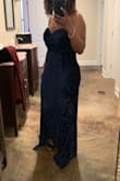 This dress was a good fit for a formal wedding. It could have been a little more fitted in the bust area as I kept having to pull it up. It does have silicone grips but my bust is heavy so there wasn't much I could do about that. It zips at the back, is stretchy and the material felt nice. overall it was a good fit. - Melanie H.