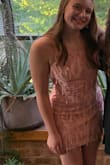 I bought this dress for my freshman homecoming, our theme was Old Hollywood, so when I found like dress I was so excited because of the fringe! When the dress arrived, I found that the fit was good, however, I wanted it to be shorter. Additionally, the ties in the back were placed so that the fabric on the sides bunched up around my boobs. My mom very generously hemmed it for me and adjusted the placement of the ties. Overall, once it was tailored, I loved it. I was very comfortable and held up for a whole night of dancing and jumping up and down. If you feel confident about your size, I would definitely recommend it! - Anna G.
