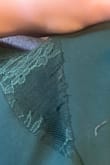 I am not sure if it came like this or not, but the side panels of lace tore very easily. I only put the dress on once to try it on, and now I'm about to put it on for my cousin's wedding, I was steaming it and noticed the tears. Otherwise, I love the dress and it fits great and looks very cute on. - Amanda U.