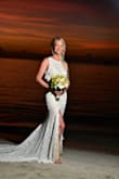 I saw this wedding dress shortly before I got engaged and knew when the time came it was the one I wanted. I purchased as soon as I was engaged and didn't look at or try on any other dresses. This fits absolutely perfectly, in all the right places. We had a beach wedding in Jamaica and it was lightweight so it wasn't too hot and the lace held up extremely well in the sand. I couldn't have asked for a better dress for the greatest day of my life! I couldn't be happier with it! - Alyssa R.