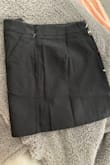 This skirt fit perfectly. Love the embroidery and the length. I wore this with black leggings and boots. Comfortable and zips up in the back. - Laurie H.