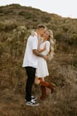 Wore this dress for my engagement photos! Worked perfectly and was not too short. If you don't want too much cleavage you can close the top with fabric tape or a safety pin. Material wrinkles easily! - Kelsey S.
