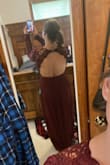 Amazing dress. Beautiful quality. True to size, but was a little loose in the back on the sides. I got a backless body suit with clear straps on Amazon to wear underneath and it was perfect. - Christine S.