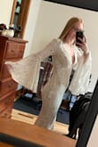 I was going back, and forth on getting the XS or XXS, and decided on the XXS because of one review on here that was that size. I am glad I did because it fits almost perfectly! I am really small all around, and it is hard for me to find any type of clothing, so when I tried this on I was thrilled it fit so well! I will need to have the sleeves, and possibly the bottom hemmed. The material is really good quality, and it even came with a dress bag, so you can hide it from your significant other! All in all, I love everything about this dress!! Very impressed with Lulus!! - Samantha A.