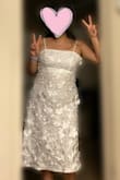 This was my first choice dress. It was so beautiful, and I loved the flowers popping out. The design was so pretty and unique. Unfortunately, it didn't fit my upper body. I tried zipping it up, but my bust or ribs were too big. The lower part did fit perfectly. I would've ordered a bigger size, but they didn't have any at the time. I returned the dress and kept the other one I ordered instead. I would recommend getting a bigger size or simply getting a different dress if your bust is bigger than mine. - Jess G.
