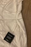 This dress has beading that was discolored and black on the left side  - it looks like mold or old. Who would pack this and send it to a customer? I just returned from my vacation and I am putting this in the mail back and hopefully, it won't get sent to another customer. I am so disappointed. I am sure someone saw this and mailed it anyway. - Teresa J.
