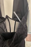 I'm 5'6, around 150lbs, and wear a 34DDD and this dress fits perfectly in a Medium! Surprisingly excellent support without a bra and looked absolutely fantastic on! I purchased this for a trip to Vegas and would have given it 5 stars, but was disappointed that at the end of the night, after only wearing it once for a few hours, I had a plastic rib break through the mesh part of the dress. - Cheyenne M.