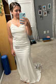 I'm having a micro wedding and have been following this dress for some time. I saw it was on sale and bought it (I spent a little over $50... even if it didn't work, can't beat that). I am a size 4-6, usually small/medium top and medium bottoms. I went with a medium at first, and there was definitely a little extra material but it was pretty fitted on my hips/bottom. I was hesitant to return for a small, as I figured I'd just get it altered. I went for the small, and it fits like a GLOVE. So happy I exchanged it. I feel like if you're between sizes- go with the smaller of the two!! - Christina S.