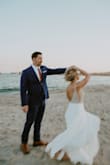 None of my family or guests could believe my wedding dress was less than $300. I did have it altered from off the rack to bring up the front garment length as I'm only 5'4. It was my dream dress and I received so many compliments throughout the course of our ceremony and reception. The skirt is heavy enough to feel expensive, but lightweight enough to flow in the breeze and twirl when I twirled. I'm not a bling girl, but loved the rhinestone and pearl bodice, it was just the right amount of sparkle. I could not wear any shapewear with this dress, as it is extremely low cut in the back, but the empress waist was extremely flattering. I opted not to have the bodice lined as I loved the sheerness on the trunk, but have seen reviews where people did both. - Caitlin P.