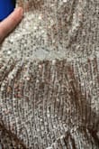 The dress was absolutely beautiful. It was so fun and comfortable. However, I only got to wear it once because the sequins came off in sections. Now there are gaps in the fabric with patches of missing sequins. - Virginia K.