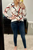 Got a lot of compliments on this shirt! It fits like any loose blouse in this style. I got an XS; I can usually swing between S and XS but go for XS on loose tops like this. I have long arms, and the sleeves were definitely long enough! I half-tucked it into the front of my jeans for work. - Megan S.
