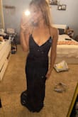 So, I'm a very small girl with a very small chest. I don't have much shape to my body and it's pretty much straight and my legs are very skinny but I don't have a super flat stomach. I have a small gut. I think this dress flatters me very well as it would a lot of people. My chest is so small though that even an XXS is a tad bit big for it but I may just have to tighten it a bit more. It definitely shows and flatters the girls a lot so be wary of any nip slips. I got the blue for a marine core ball but really wanted the red but it's sold out :( Also, I preferred the green but the blue goes much better with this event. Also, one other thing I wish it was satin and more sequins like the satin underneath the mesh but either way, it's definitely beautiful. I'm just picky but I LOVE the back. If you are my height, heels will easily fix the length. If you like long dresses but not too long this is perfect. I find the length pretty but I feel that I may be stepping on it a lot. - Makleah T.