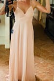 Has fit everyone in the bridal party even those with a large bust. Fits true to size, but it's long so I'll have to take it to a seamstress. I couldn't button it all the way alone, so the photos don't do it justice. - Elisabeth A.