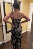 I honestly love this dress !! I'm a 32C. It did fit a little snug right under my boob area but a good set of Spanx fixed it. It shows just enough of my chest area not exposing so much, felt very elegant. Also, this has a slight stretch to it just enough to breath. - OLIVIA D.