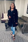 The material was good and did not feel cheap! The jacket fit right on the shoulders and length but I was not able to button it from the tummy area jacket fit a bit small. If you want to wear it open and a cute shirt under M fits me well but if you need it to button I would size it up. - Judith R.