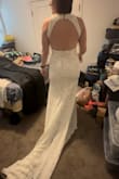 This dress is BEAUTIFUL. The pics don't do it justice as it was a video and I was screenshotting them. I am small in the chest but large [in the] bottom half, and I don't feel like it brought too much notice to that. With some spanx on, I think it will be perfect. I did have to take in the neck as it was too loose, but it took the person 10 mins to do. - Kelly J.