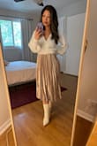 Beautiful champagne color, just as pictured! Looks great with both light and dark tops. As other reviewers noted, the length can be easily adjusted by rolling the waistband inward. Can't wait to wear it to some upcoming holiday parties! - Joy I.