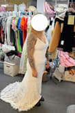 I love this dress. It is more than I expected. I am really short so it has to be shortened an inch but it's not bad for buying it online and not trying it on beforehand. It's more affordable than any bridal shop I've been to and the quality is amazing. I highly recommend it. - Rachelle B.
